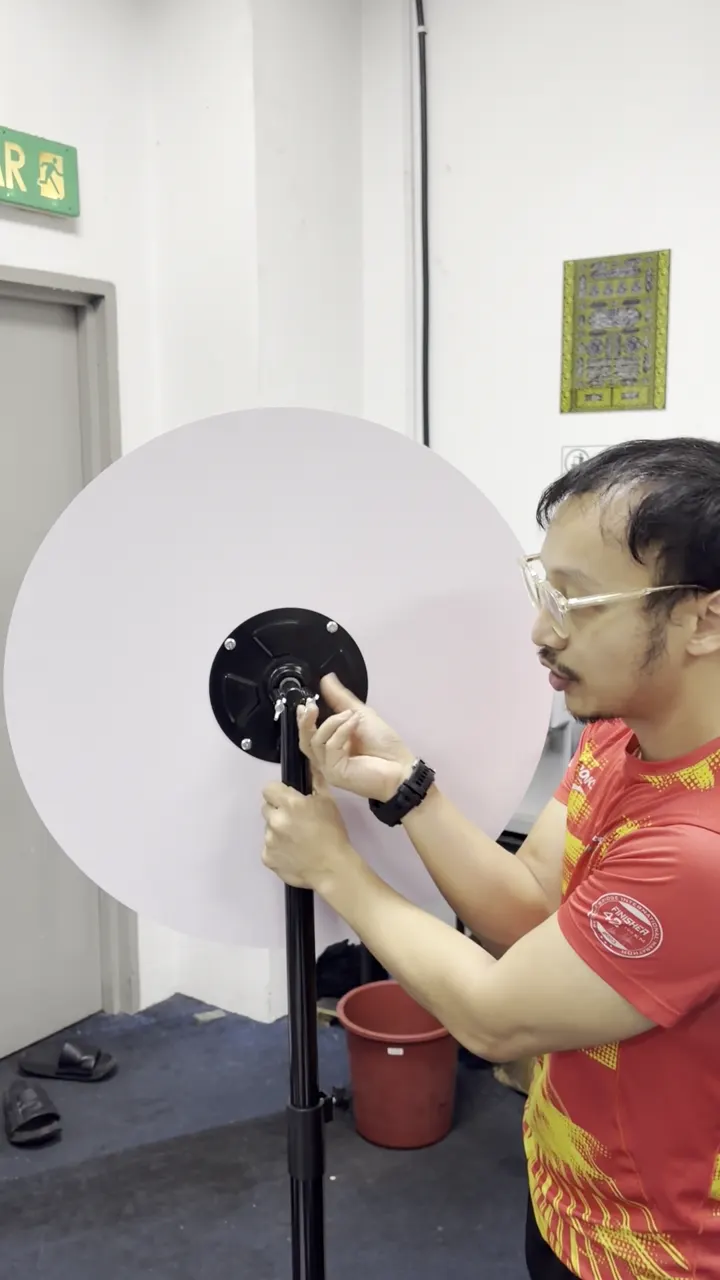 The printed lucky spin board being mounted onto the spinner mechanism